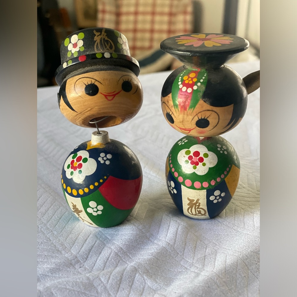 Wooden Asian Bobbleheads.